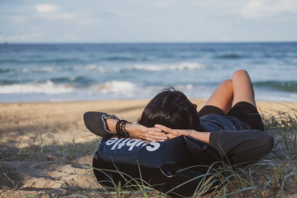 woman resting on bag