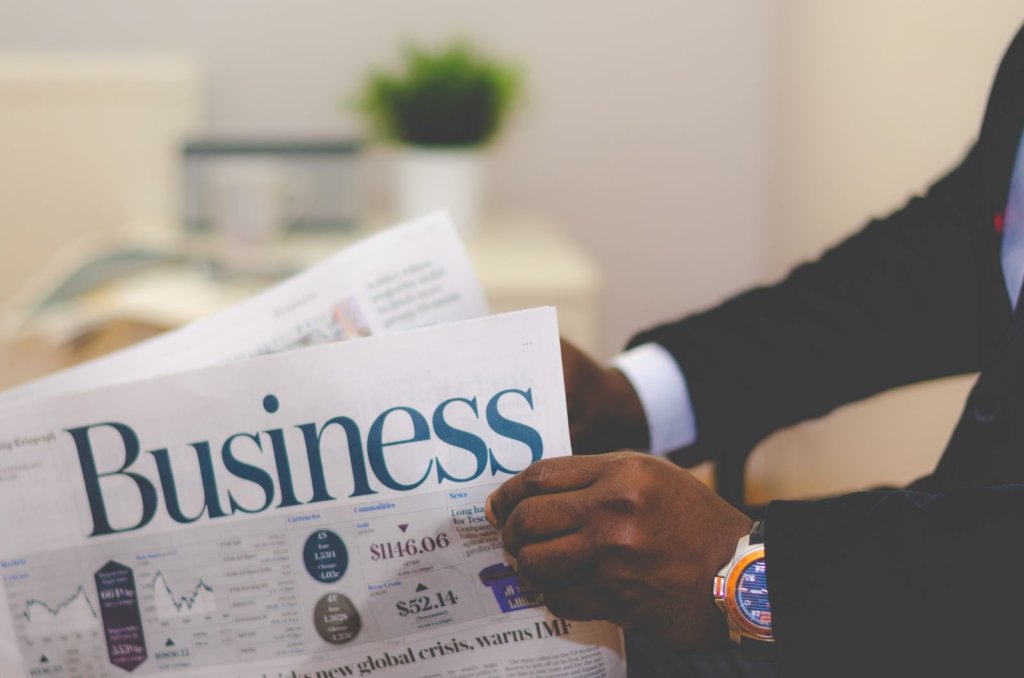 businessman holding a newspaper