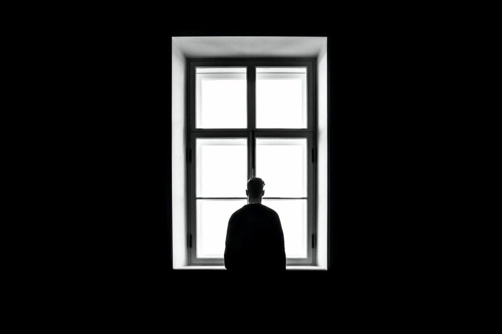 man in front of a window
